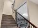 Interior staircase with wooden rails and a contemporary design at 3465 Gulfmead Dr, Sarasota, FL 34242