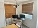 Bright dining area with woven blinds, a glass table, and seating for a casual meal at 3710 Gulf Of Mexico Dr # A20, Longboat Key, FL 34228