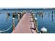 Well-maintained boat dock with sturdy pilings, offering convenient access to the sparkling water for boating enthusiasts at 3710 Gulf Of Mexico Dr # A20, Longboat Key, FL 34228