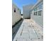 Exterior view shows patio area and side of two houses at 3710 Gulf Of Mexico Dr # A20, Longboat Key, FL 34228