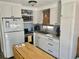 Efficient kitchen featuring white cabinets, modern appliances, and a functional layout at 3710 Gulf Of Mexico Dr # A20, Longboat Key, FL 34228