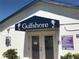 Community pool entrance with Gulfshore sign and hours at 3710 Gulf Of Mexico Dr # A20, Longboat Key, FL 34228