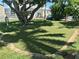 A private putting green with manicured grass offers relaxation and entertainment in the backyard of this home at 3710 Gulf Of Mexico Dr # A20, Longboat Key, FL 34228