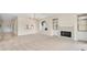 Spacious living room featuring a fireplace with built-ins and a view of the front entry at 3916 Chatsworth Greene # 3, Sarasota, FL 34235