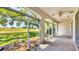 Screened-in patio with ceiling fan overlooking the golf course at 3916 Chatsworth Greene # 3, Sarasota, FL 34235