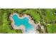 Aerial view of a large community pool surrounded by lush landscaping and ample seating at 4010 Lindever Ln, Palmetto, FL 34221