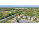 Residential area showcasing the home's placement among lush greenery and nearby houses at 4010 Lindever Ln, Palmetto, FL 34221