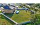 Spacious fenced backyard featuring a pool and playground, perfect for outdoor enjoyment at 4010 Lindever Ln, Palmetto, FL 34221