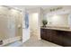 Updated bathroom featuring a walk-in shower and double vanity with granite countertops at 4010 Lindever Ln, Palmetto, FL 34221