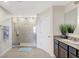Bright bathroom features a glass enclosed shower, granite counters, and tile floors at 4010 Lindever Ln, Palmetto, FL 34221