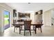 Open concept dining area showcases tile flooring and kitchen with granite countertops and modern appliances at 4010 Lindever Ln, Palmetto, FL 34221