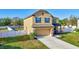 Well-maintained two-story home with an attached garage and a beautifully landscaped front yard at 4010 Lindever Ln, Palmetto, FL 34221