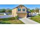 Attractive two-story home with a two-car garage and meticulously maintained lawn in a suburban neighborhood at 4010 Lindever Ln, Palmetto, FL 34221