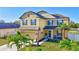 Beautiful two-story home with a well-kept lawn, lovely landscaping, and a welcoming front porch at 4010 Lindever Ln, Palmetto, FL 34221