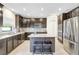 Stylish kitchen with stainless steel appliances, granite countertops, and a central island with seating at 4010 Lindever Ln, Palmetto, FL 34221