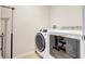 Dedicated laundry room with modern washer and dryer units, offering convenience and efficiency at 4010 Lindever Ln, Palmetto, FL 34221