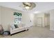 Bright living room with tile floors, a ceiling fan, and ample natural light at 4010 Lindever Ln, Palmetto, FL 34221