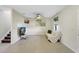Cozy living room with tile flooring, neutral walls, a ceiling fan, and modern decor at 4010 Lindever Ln, Palmetto, FL 34221