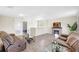Second-floor living room features a fireplace, comfortable seating, and an open layout at 4010 Lindever Ln, Palmetto, FL 34221