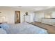 Spacious main bedroom with ensuite bathroom, wood floors, and ample natural light at 4010 Lindever Ln, Palmetto, FL 34221