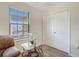 Bright room with a large window, a cozy chair, and ample closet space at 4010 Lindever Ln, Palmetto, FL 34221