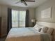 Relaxing bedroom with a comfortable bed, soft linens, and window at 4166 Central Sarasota Pkwy # 535, Sarasota, FL 34238