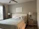 Cozy bedroom offers a comfortable bed and natural light from the window at 4166 Central Sarasota Pkwy # 535, Sarasota, FL 34238