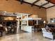 Large rec room featuring high beamed ceilings, built in bookcases, a full bar and tile flooring, perfect for entertaining at 4166 Central Sarasota Pkwy # 535, Sarasota, FL 34238