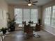 Dining room with a table, chairs, and plant decor at 4166 Central Sarasota Pkwy # 535, Sarasota, FL 34238