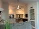 Living room with a sectional sofa and view of kitchen at 4166 Central Sarasota Pkwy # 535, Sarasota, FL 34238