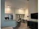 Bright living area features a breakfast bar, stainless steel appliances, and a dedicated workspace at 4166 Central Sarasota Pkwy # 535, Sarasota, FL 34238