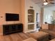 Comfortable living room with a sectional sofa and television at 4166 Central Sarasota Pkwy # 535, Sarasota, FL 34238