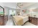 Bright bedroom with neutral decor, large windows, and tile flooring at 4186 Heron Way # B-219, Bradenton, FL 34205