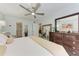 Spacious bedroom with light blue walls, tile flooring, and neutral decor at 4186 Heron Way # B-219, Bradenton, FL 34205