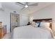 Bedroom featuring a ceiling fan and access to the bathroom at 4186 Heron Way # B-219, Bradenton, FL 34205