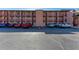 Exterior view of building with parking in front on a sunny day at 4186 Heron Way # B-219, Bradenton, FL 34205