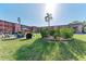 Well-maintained community space with a seating area, grill, and vibrant landscaping at 4186 Heron Way # B-219, Bradenton, FL 34205