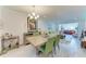 Open concept dining room and living room with stylish furnishings and decor at 4186 Heron Way # B-219, Bradenton, FL 34205