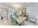 Bright dining room featuring stylish decor, an open layout, and seamless access to the adjacent kitchen at 4186 Heron Way # B-219, Bradenton, FL 34205