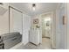 Hallway featuring a built in closet, dresser, and access to the bathroom at 4186 Heron Way # B-219, Bradenton, FL 34205