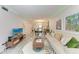 Spacious living room with decorative furniture and tile flooring at 4186 Heron Way # B-219, Bradenton, FL 34205