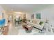 Open living room with tile floors and view of dining area at 4186 Heron Way # B-219, Bradenton, FL 34205