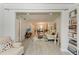 Open-concept living room with stylish furniture and a view into the dining room at 4186 Heron Way # B-219, Bradenton, FL 34205