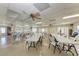 Spacious meeting room with tables, chairs, ceiling fans, and ample natural light at 4186 Heron Way # B-219, Bradenton, FL 34205