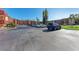 Large parking lot with a blue SUV and multi-story residential buildings in the background at 4186 Heron Way # B-219, Bradenton, FL 34205