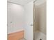 Bright bathroom with tiled shower, wood floors, and white painted doors and trim at 4225 Overture Cir, Bradenton, FL 34209