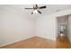 Bright, spacious bedroom featuring wood floors, ceiling fan, and crown molding at 4225 Overture Cir, Bradenton, FL 34209