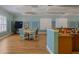 Bright clubhouse interior featuring tables, chairs, kitchen, and wall decor at 4225 Overture Cir, Bradenton, FL 34209