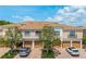 Beautiful townhome exteriors featuring manicured landscaping, multiple garage bays, and ample parking at 4225 Overture Cir, Bradenton, FL 34209
