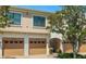 Close-up of well maintained townhome garages with a landscaped walkway at 4225 Overture Cir, Bradenton, FL 34209